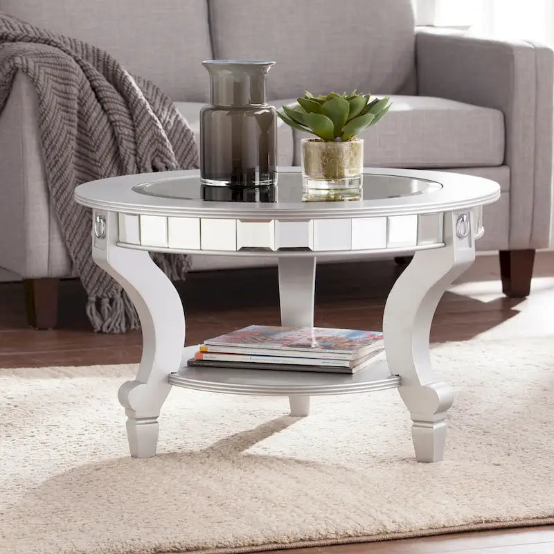 SEI Furniture Olivia Contemporary Mirrored Round Coffee Table in Matte Silver Details and Shelf